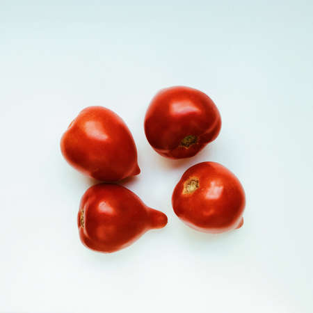 fresh red tomatoes isolated on white background. flat layの写真素材