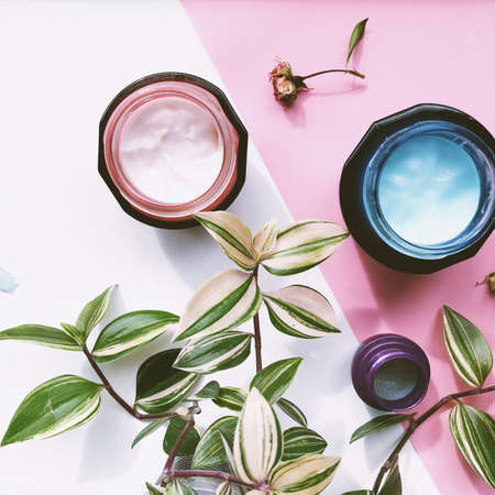 face cream with selective focus. Cosmetics pink and white backgroundの写真素材