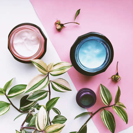 face cream with selective focus. Cosmetics pink and white backgroundの写真素材