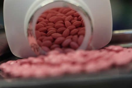 Pink filmcoated tablets