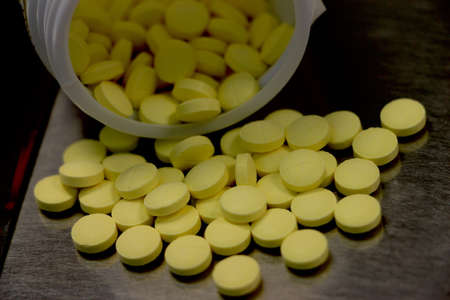 Yellow filmcoated tablets