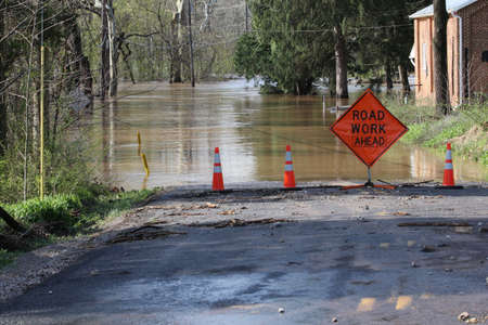 Flooded road with funny sign.