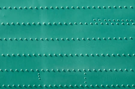 Military metal steel texture with lots of rivets.の写真素材