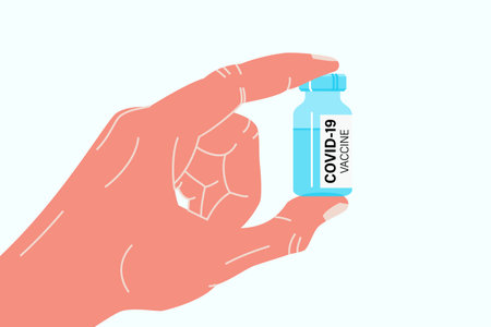 Hand holding antiviral covid 19 vaccine. Covid or coronavirus vaccinationのイラスト素材