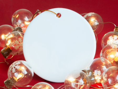 Ceramic Christmas decoration. Christmas ornament on the Christmas lights background.の写真素材