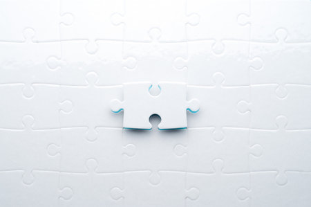 White jigsaw puzzle on a vibrant blue background with one missing piece. Concept for...