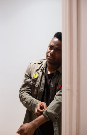 African American looking at the camera just before putting his covid 19 mask