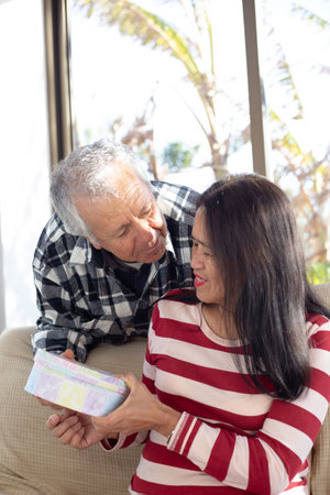 Old couple in valentines day about to kiss each otherの写真素材