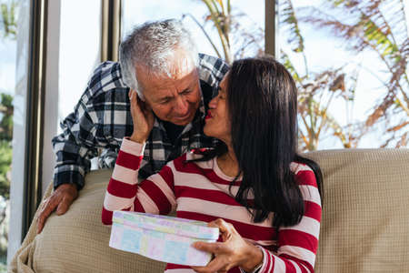 Old couple in valentines day with lovely presentsの写真素材