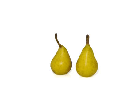 two yellow pears on white background leaving plenty of empty space aroundの写真素材