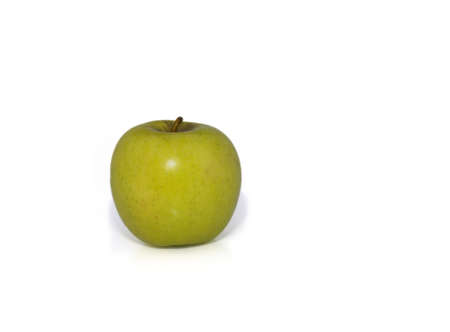 yellow apple on white background  leaving enough white space aroundの写真素材