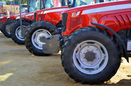 view of the front of tractors at an exhibitionの写真素材