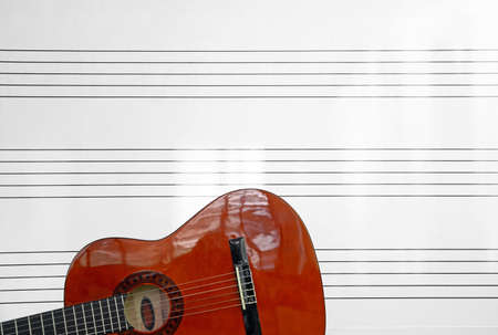 detail of a Spanish guitar and whiteboard with staveの写真素材