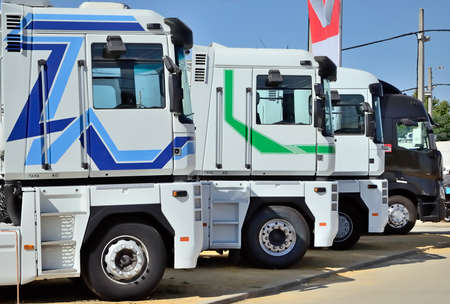 four new trucks parked stepwise