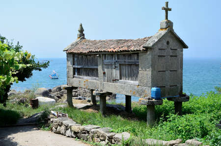 Horreo by the sea, built on four pillars barn Intended store grain so this is isolated from moisture, is characteristic of northwestern Spain, in Asturias and Galicia Especially.の写真素材