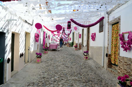 Flower Festival Festas do Povo, Campo Maior 2015. Many streets of the historic center are coated With Thousands of paper flowers, handmade by the people of Campo Maior. Photo taken on: August 24th, 2015.のeditorial素材