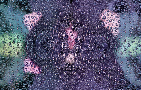 detail of drops on a glass in bright colors