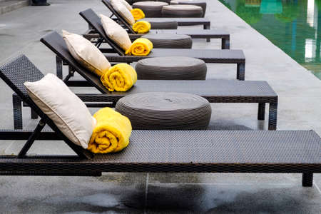 A row of beds, Spa with pillow and towel on outdoor, Spa for healing and relaxingの写真素材