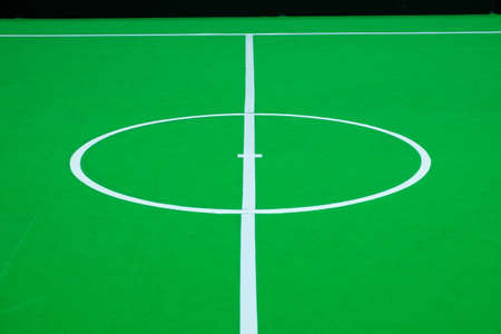 Close-up center of soccer field on indoor for robot soccer competition, On the ground floor is covered with green flannelの写真素材