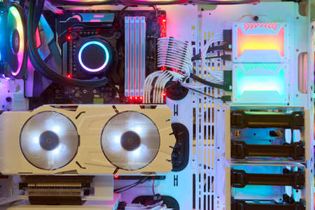 Close-up and inside Desktop PC Gaming and Cooling Fan CPU with multicolored LED RGB light show...