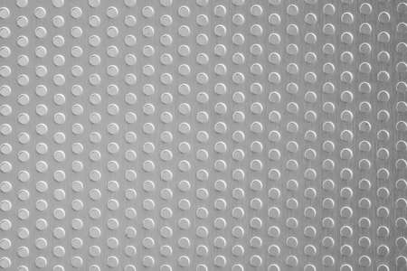 Polished stainless steel plate with a porous circle texture, steel plate detail and pattern...