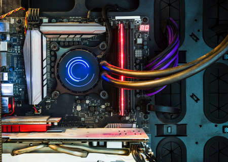 Close-up and inside Desktop PC Gaming and Cooling Fan CPU with multicolored LED RGB light show status on working mode, interior PC case technology backgroundの写真素材