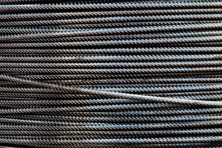 Close-up stacked wire steel rebar material, rebar for industrial and construction work, texture and backgroundの写真素材
