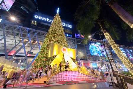Bangkok-Thailand DEC 3 2019: Giant Christmas tree and Christmas theme decoration and blurred people moving at Central World on night scene, one of landmarks of Bangkok for countdown to a New Yearのeditorial素材