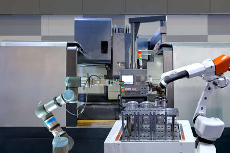 Industrial robotic working with metal part and CNC Machine on smart factory, industry 4.0 and AI, automation robot work instead on human conceptの写真素材