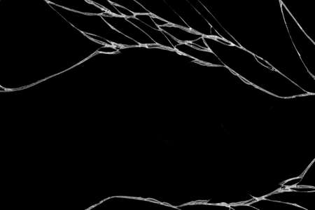 Art of wrinkles and cracks of glass caused by smashing and falling bumps. isolated on black background, This crack can be used as a pattern of floor tileの写真素材