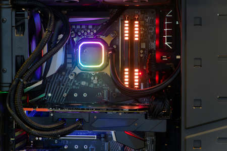 Close-up and inside high performance Desktop PC and Cooling system on CPU socket with multicolored LED RGB light show status on working, interior on Computer PC Case and DIY, technology backgroundの写真素材