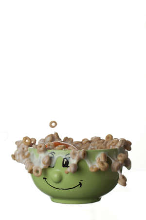Cereals and milk jumping out of a funny bowl