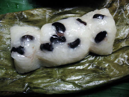 Glutinous rice steamed in banana leaf  khao tom matの写真素材