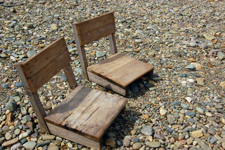 wood chairs on stone backgroundの写真素材