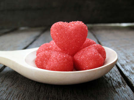 hearts with wooden spoon on old wood backgroundの写真素材