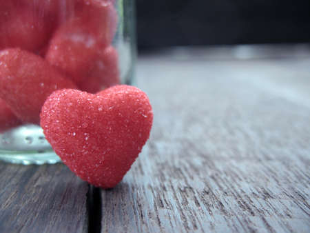 small red heart on wood backgroundの写真素材