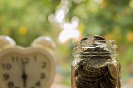 stack of coins full in glass jar,concept for money and  save for future.の写真素材