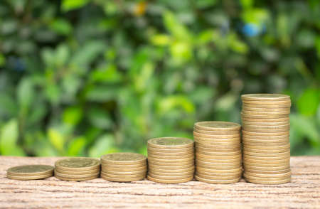 Stack of coins with green with money saving concept.の写真素材