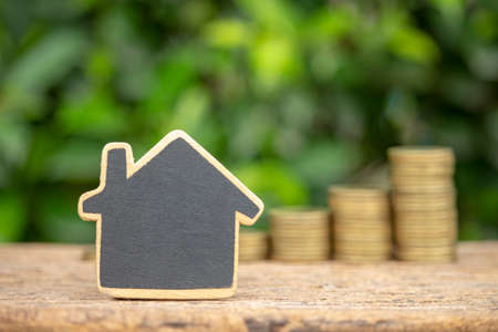 Money saving concept for buy house image of house model and stack coins.の写真素材