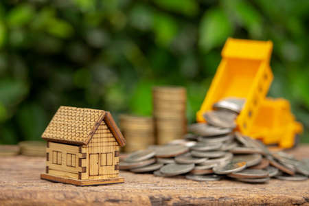Money saving concept for  buy house, image of house model and stack coinsの写真素材
