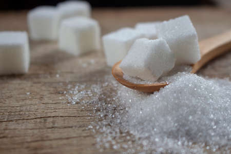 Sugar on wooden spoon, for healthy care article.の写真素材