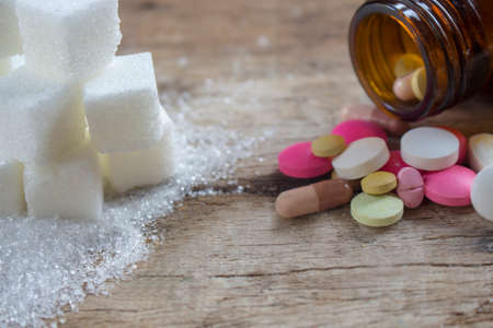 Sugar and medicine, unhealthy,the danger of excessive sugar intake concept.の写真素材