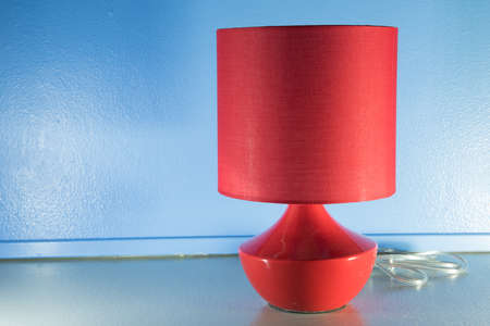 red lamp on table  texture gray and blackground blueの写真素材