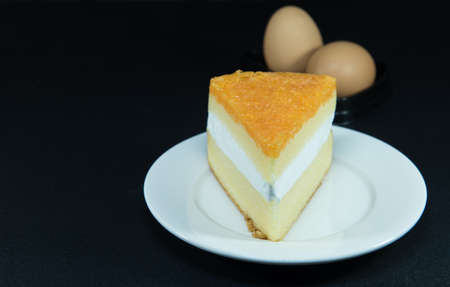 Gold threads cake isolated with egg  background on texture blackの写真素材