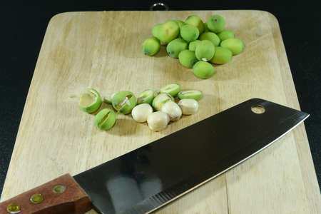 Lotus Seed on blockWith knifeの写真素材