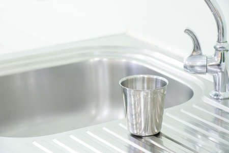 Glass stainless put on the sinkの写真素材
