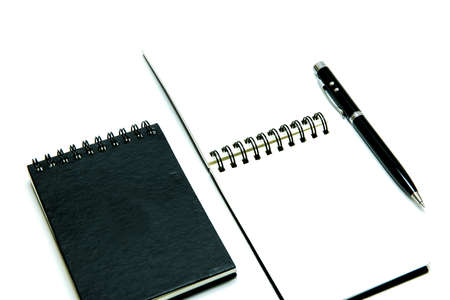 Note book,pen on white background , isolated