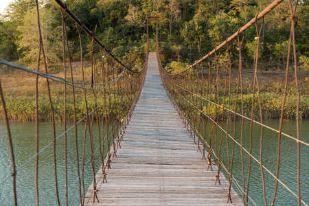 suspension bridge made of wood and sling.の写真素材