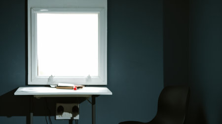 Picture of a white window and a desk with light from outside shining through, but the atmosphere in the room is dark, with the concept of darkness, suffering, anxiety, loneliness, and hopelessness.の素材