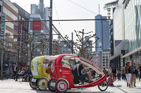 Bike taxis in Frankfurt city: sustainability and modern city life. Frankfurt am Main, Germany -...
